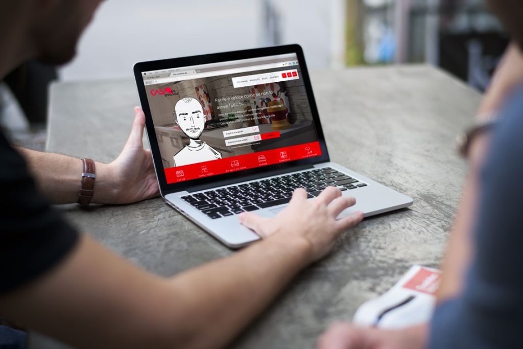 portfolio-1-casa-in-arreda-alessia-curcio-UI-UX-designer man show website on a computer